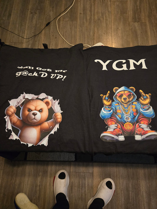 Black YGM shirt, blue bear, white font