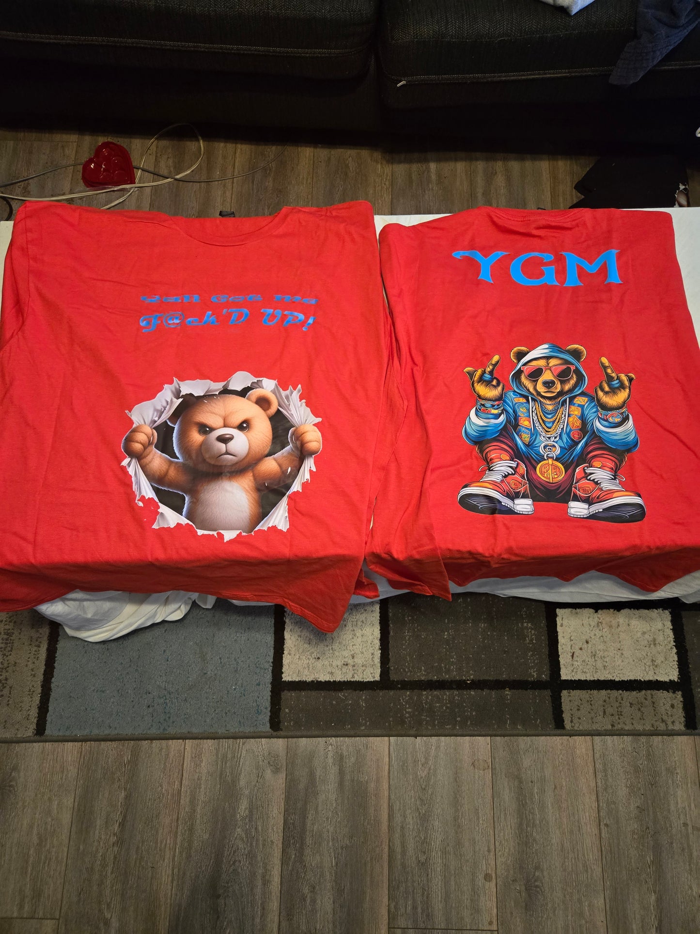 Red YGM shirt, blue bear, blue font